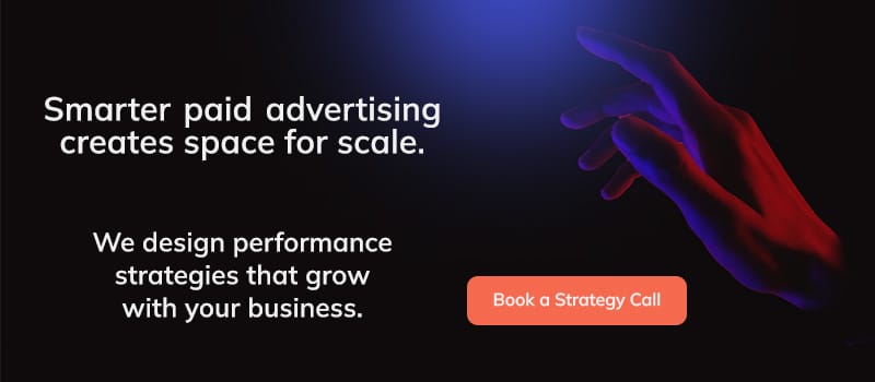Dark website banner with the text “Smarter paid advertising creates space for scale,” a glowing hand image, and a “Book a Strategy Call” button.